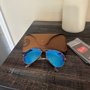 RayBan aviators. Gold frames with polarized lenses.